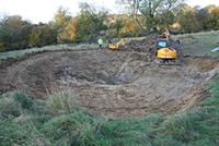 The pond being constructed