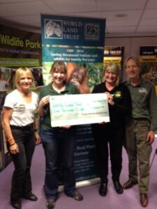 Representatives of Paradise Wildlife Park present Kelly Jacobs with a cheque for £1,000.