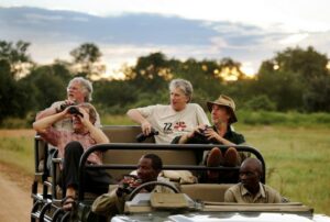Bill Oddie in a jeep in Zambia