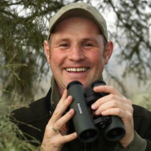 Mike Dilger with binoculars