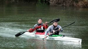 Steve Backshall and George Barnicoat in a kayak.