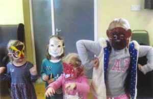 Children from St John's wearing animal masks.