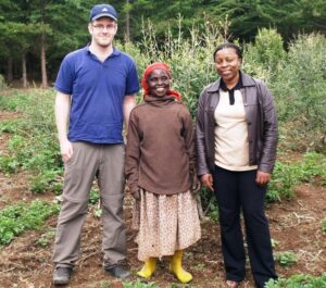 Chris Smith and Joan Gichuki with a local farmer at Mount Kenya.
