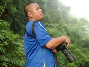 Ranger Berjaya searching for wildlife in the Deramakot Forest Reserve.