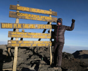 Helen Cox at the summit of Kilimanjaro.