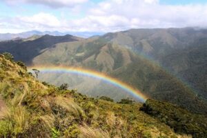 A double rainbow falls over the Montane Forest and Paramo of the San Juan de Sallique ACP