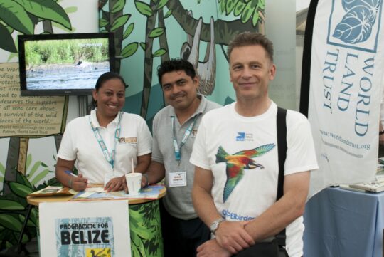 World Land Trust's stand at Birdfair 2015. Chris Packham with Vladimir Rodriguez and Therese Jonch from Programme for Belize.