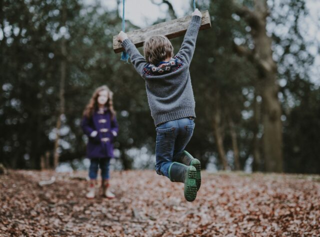 Children Playing with a Swing. Credit: Annie Spratt on Unsplash