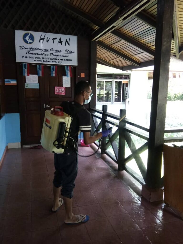 A worker disinfects a public area. Credit: HUTAN.