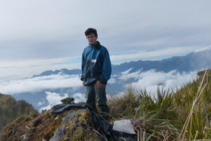 Darwin Recalde standing on a mountain in the Andes