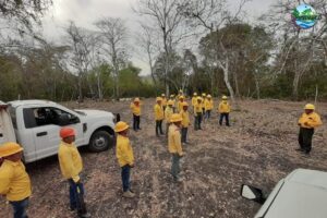 Image of a fire fighting team in Guatemala, gathering for a socially distanced briefing.