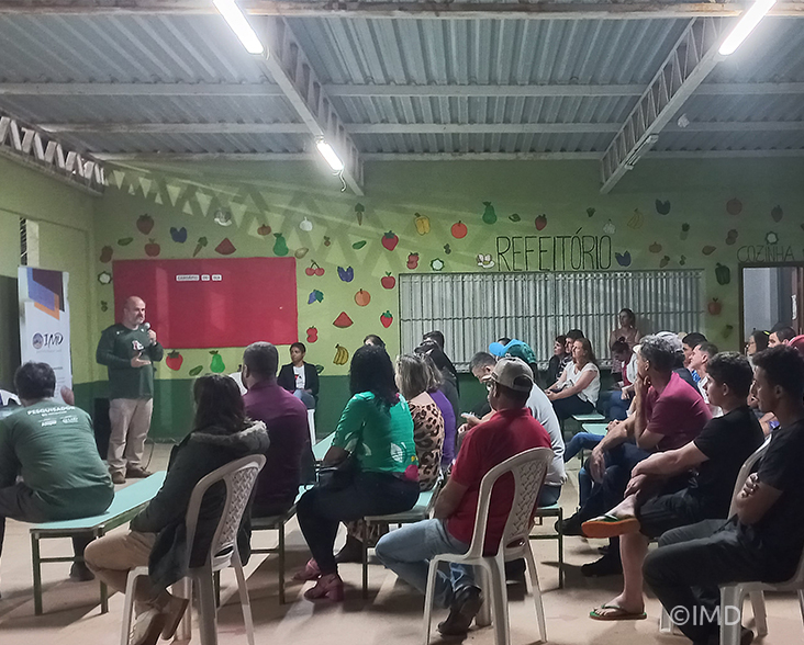 Community members learning from an IMD presentation