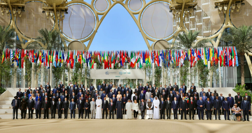DECEMBER 1: World Heads of States pose for a group photo at Al Wasl during the UN Climate Change