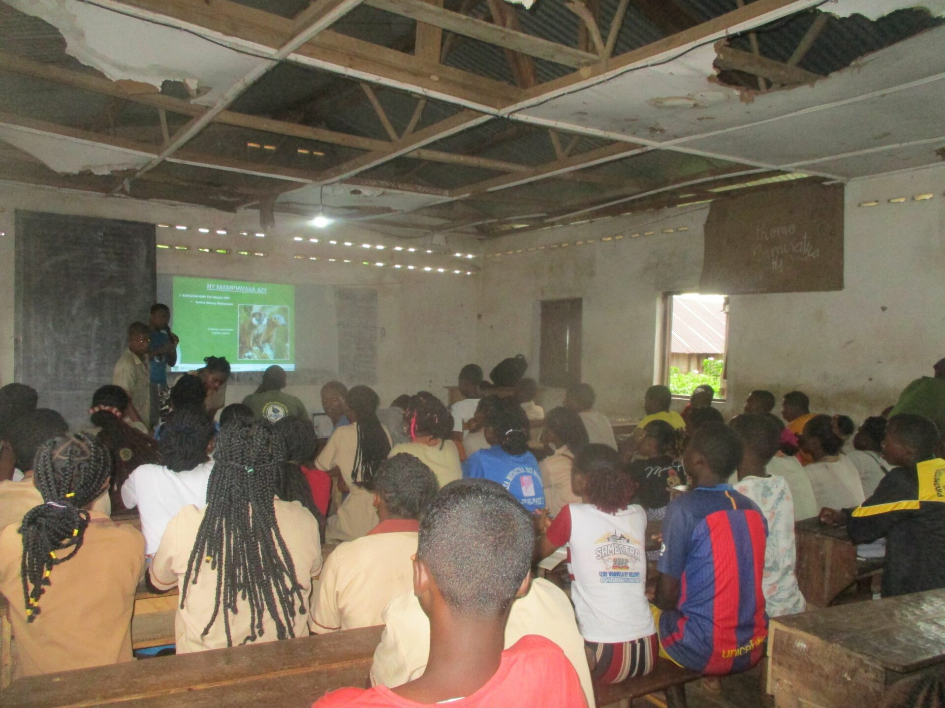 A photograph of children in a classroom during an environmental education lesson given by MBG-Madagascar. Credit: David Rajaonarivelo