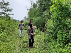 WTI staff and volunteers inspect a fence