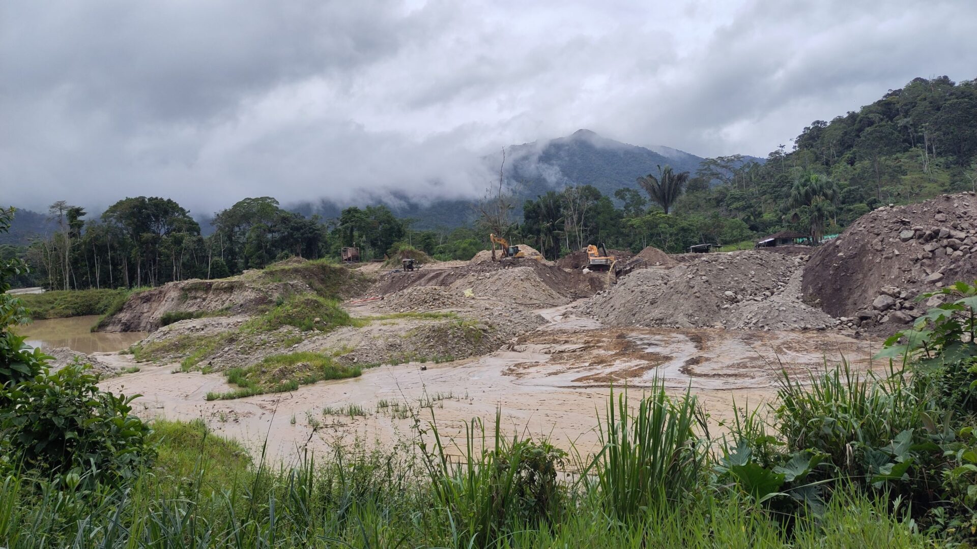 A photo of illegal gold mining disrupting the natural landscape of the riverbed. Credit: Mary McEvoy