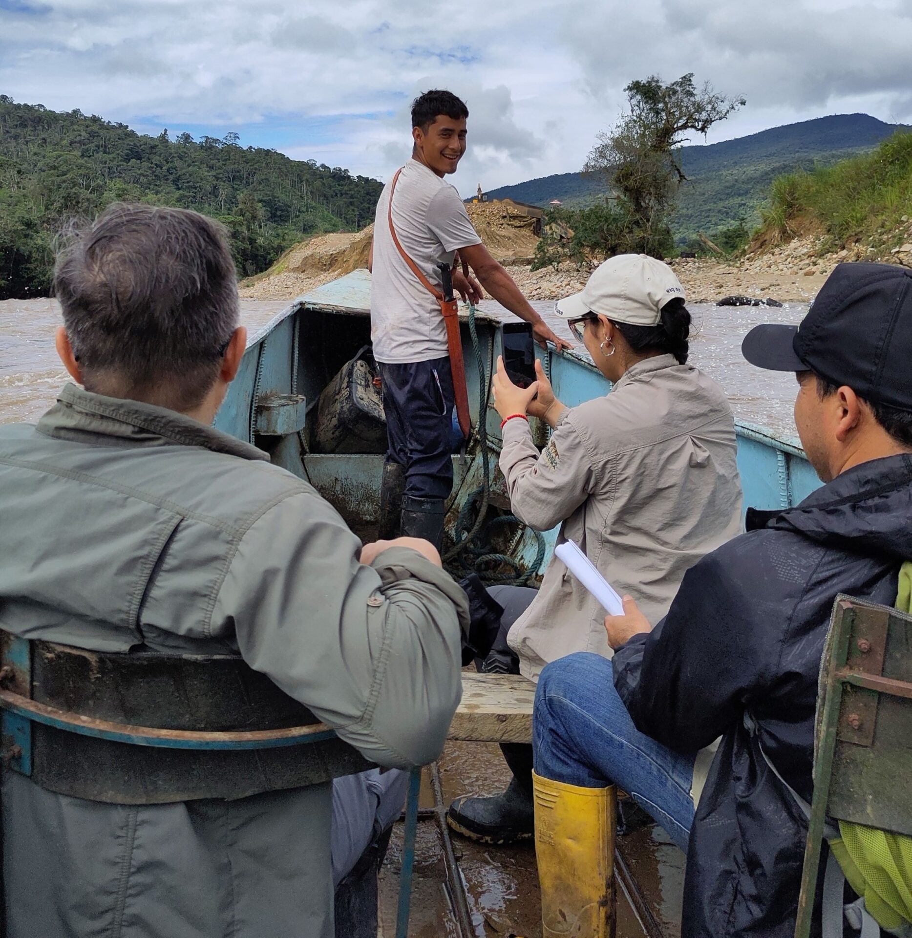 A photo of the NCE team crossing the river with Joel at the front of the boat. Credit: Mary McEvoy