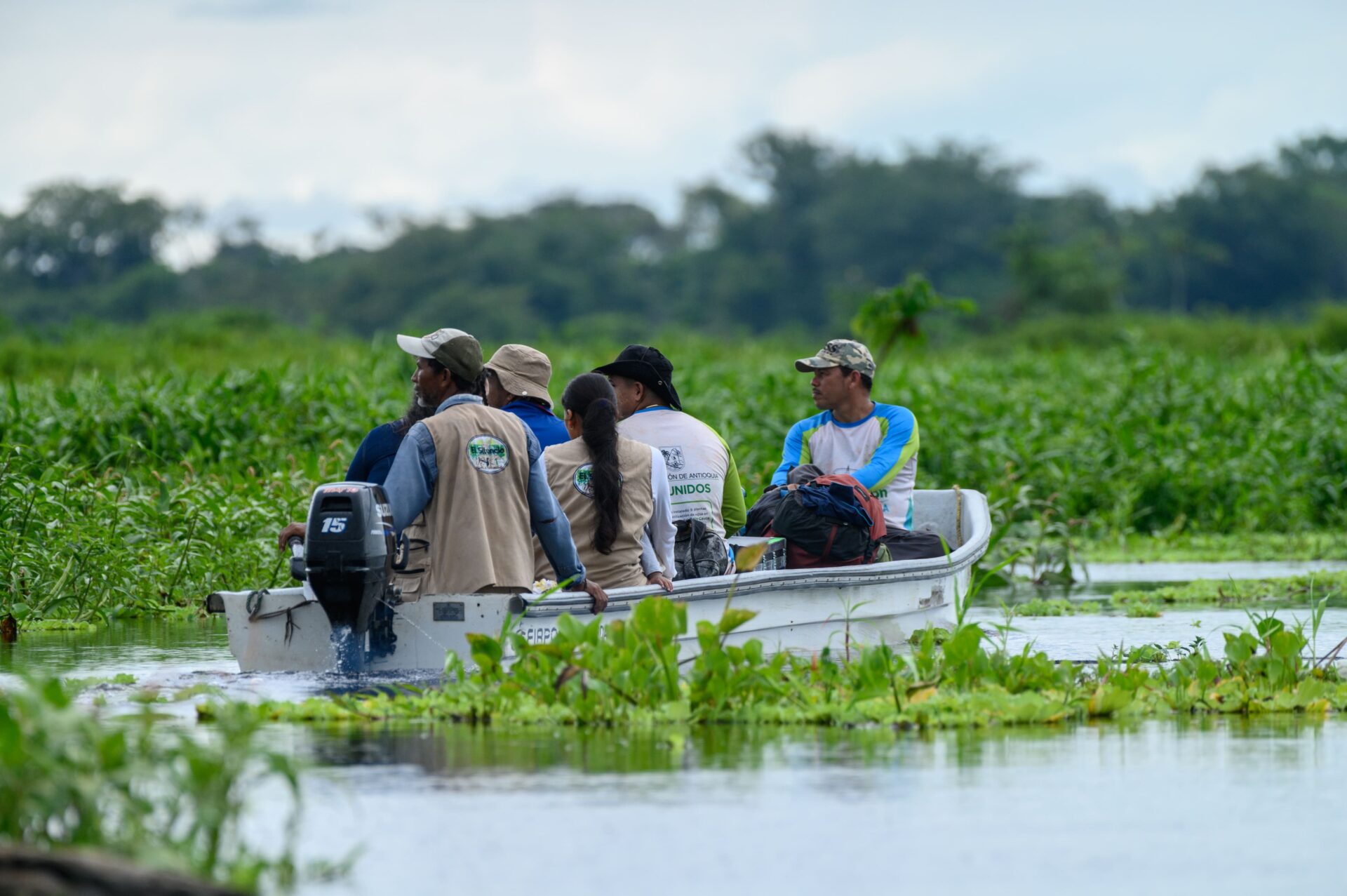 FBC rangers travelling by boat through the wetlands.