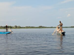 Fishermen casting their nets on the Barbacoas wetlands.