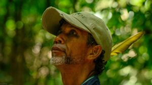 Forest ranger Julio Cruz stares into the trees.