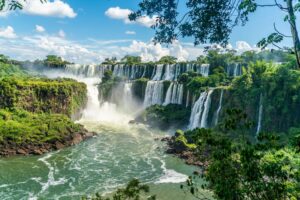 A photo of the iconic Iguazú Falls, a system of 275 waterfalls whose name calls from the Indigenous Guarani and means “big water”. Taller than Niagara Falls and wider than Victoria Falls, it is an apt name. Credit: Ivo Antonie de Rooij/Shutterstock