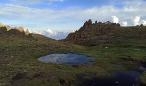 A photograph of a lake high in the mountains of the Sierra de Ambato.